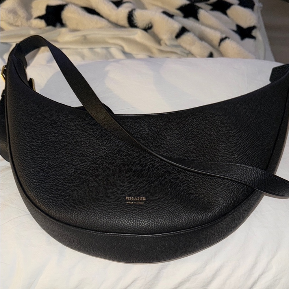 KHAITE Black Hobo Bag with Crescent Shape and Thick Strap